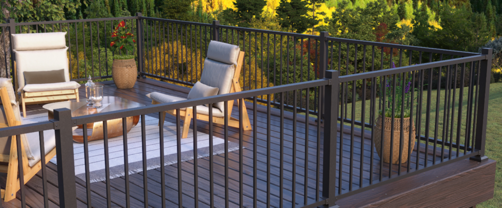 KeyLink Discovery Series black aluminum railing with round balusters, budget-friendly metal deck railing ideas.
