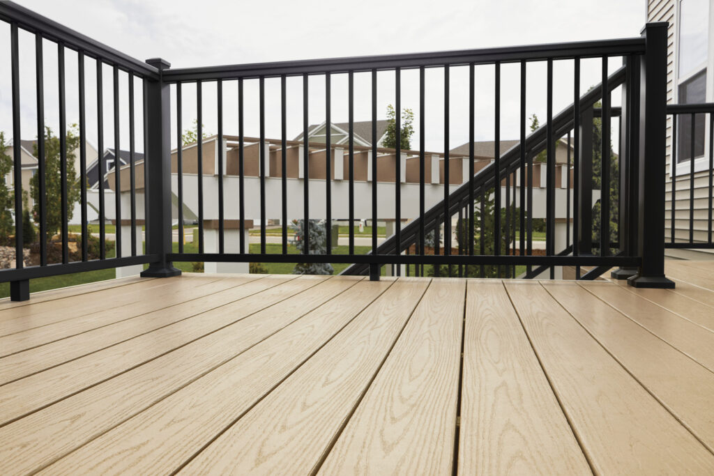 Black TimberTech Impression Rail Express on a Brownstone composite front porch with a window box, metal deck railing ideas for small spaces.