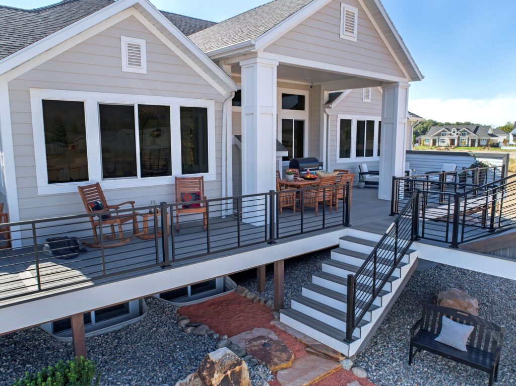 Trex Signature Rod Rail with horizontal black rods on a gray composite deck and stair run.