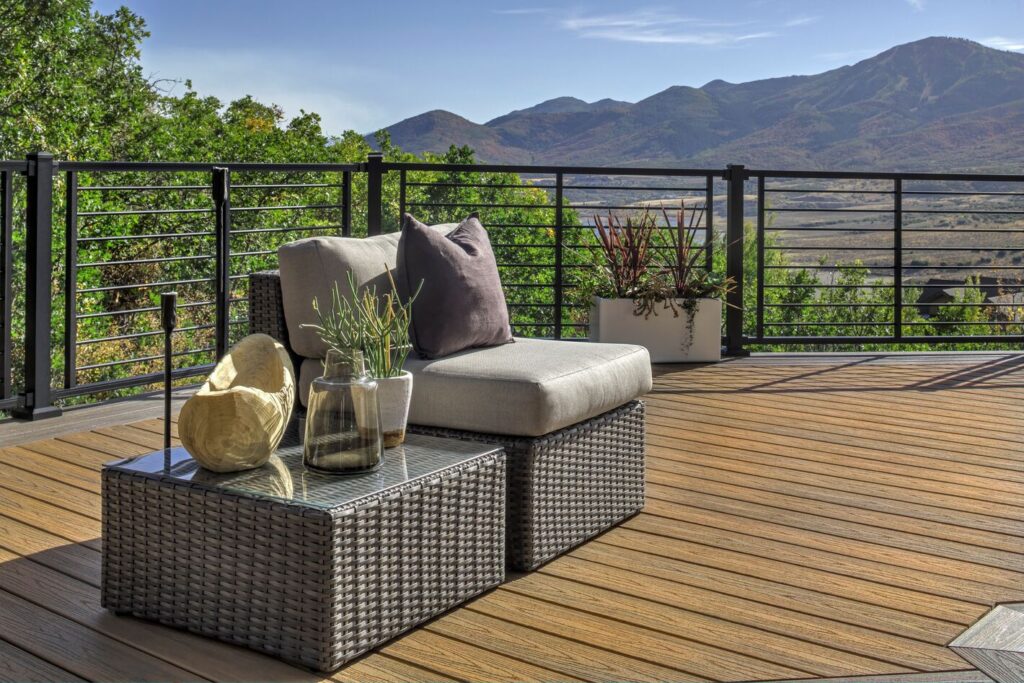 Trex Signature Rod Rail with horizontal rods on a tan composite deck facing mountains, horizontal metal deck railing ideas.