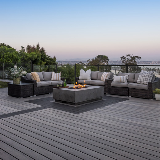 Modern gray deck with outdoor seating for homeowners looking to buy composite decking
