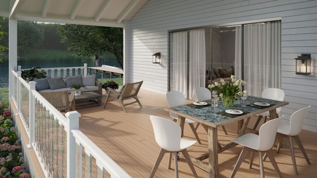 Envision Distinction Hampton Dunes deck with white railing, covered dining area, lounge seating, and lakeside view.