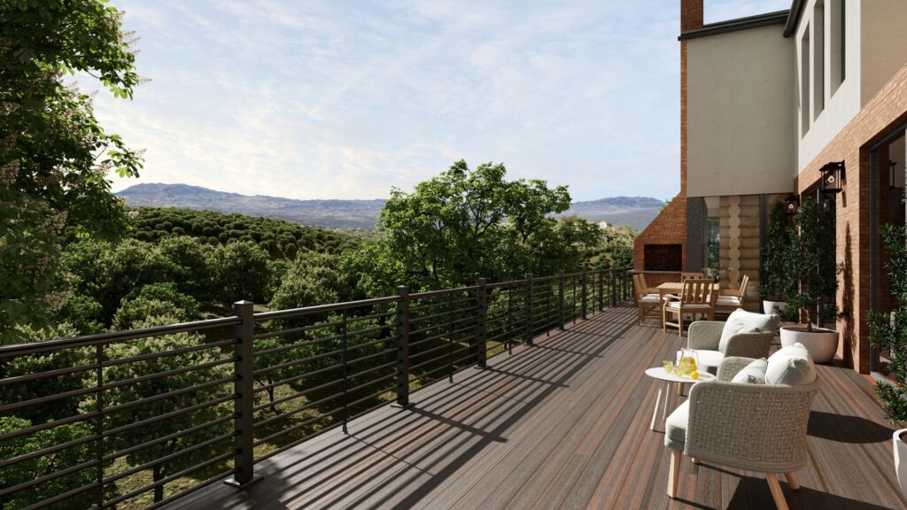 Envision Distinction Rustic Walnut deck with horizontal dark railing, dining furniture, lounge seating, fireplace, and mountain views.