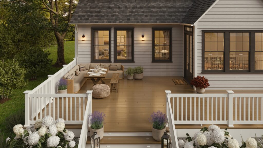Envision deck ideas featuring Ridge Premium Baja Tide decking with white railing, outdoor dining area, wide stairs, planters, and hydrangeas.