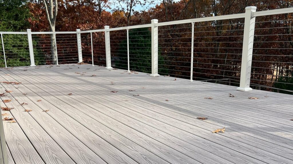 Fiberon deck ideas featuring Good Life Cabana decking with white railing and dark contrasting top rails.