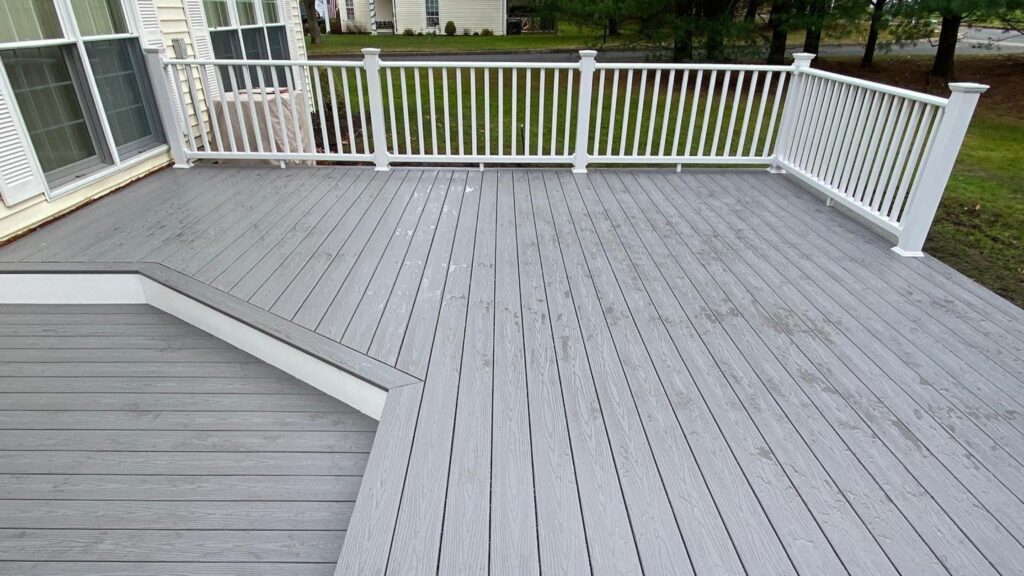 Fiberon Good Life Cottage multi-level deck with white railing and angled deck transition.