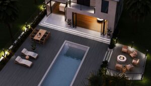 New Trex Outdoor Lighting illuminating a modern pool deck with stair lights, under-rail lighting, and post cap lights at night.