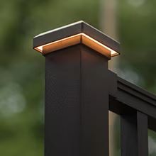 New Trex outdoor lighting shown from daylight to dusk and night on a modern pool deck.