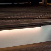 Trex linear riser light providing continuous illumination across a deck stair.