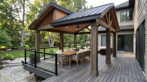 Modern outdoor pavilion with solid roof covering a composite deck and dining area.